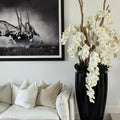 San Jose Vase in glossy black with hanging yellow orchids – The Ever Botanic